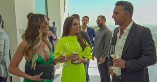 Farrah Brittany, Alexia Umansky and Mauricio Umansky talking at a party in Buying Beverly Hills