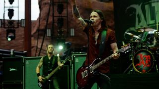 Myles Kennedy performs with a red PRS McCarty