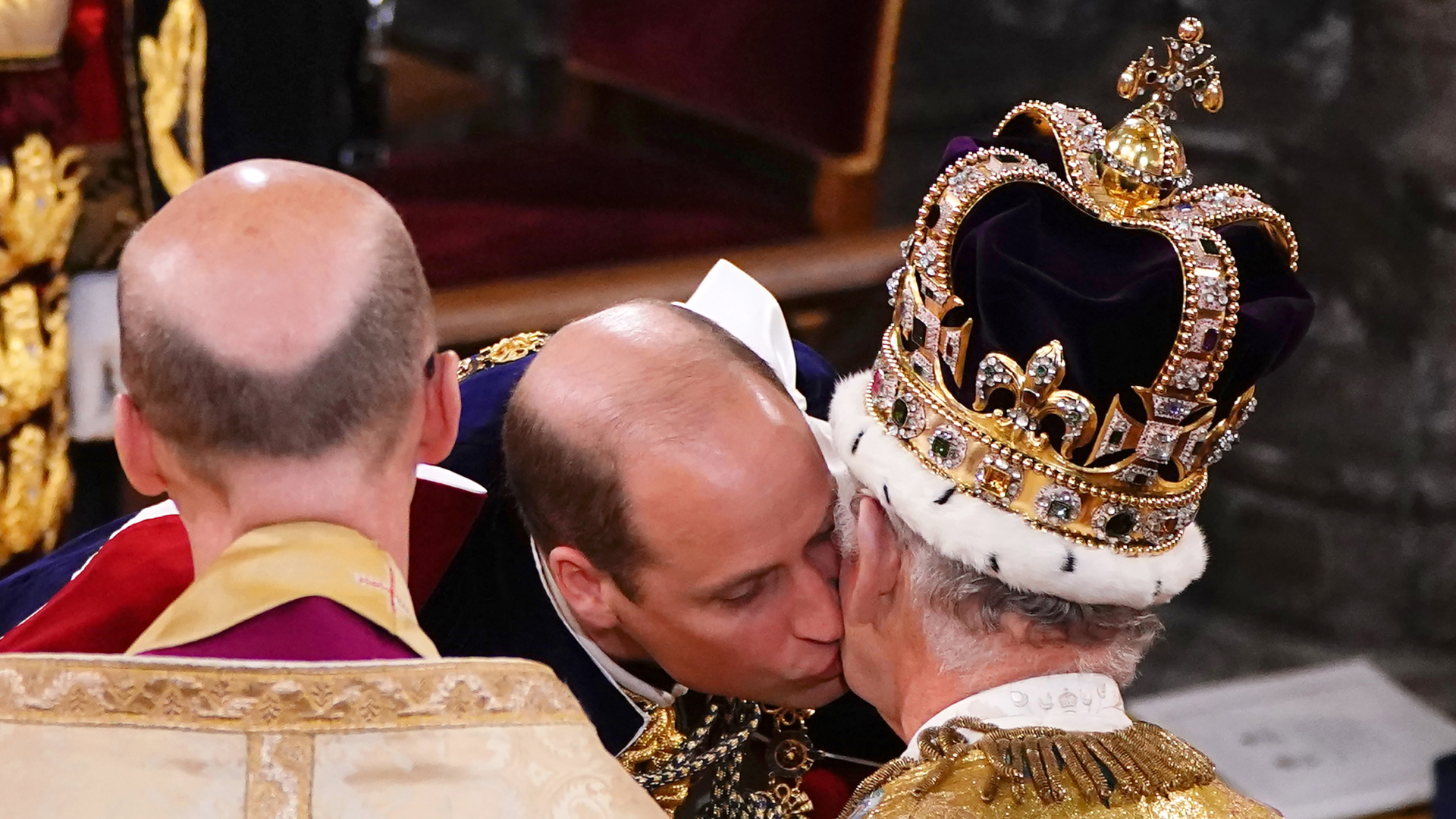 Prince William kissing King Charles at his coronation