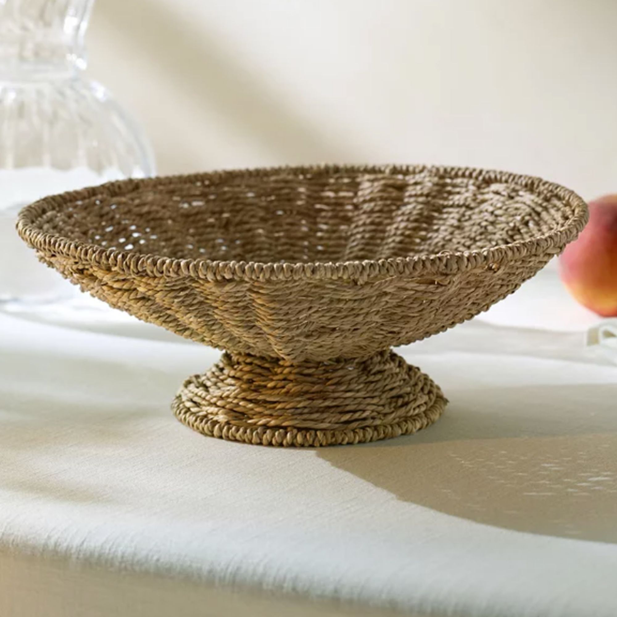 rattan footed bowl on neutral background
