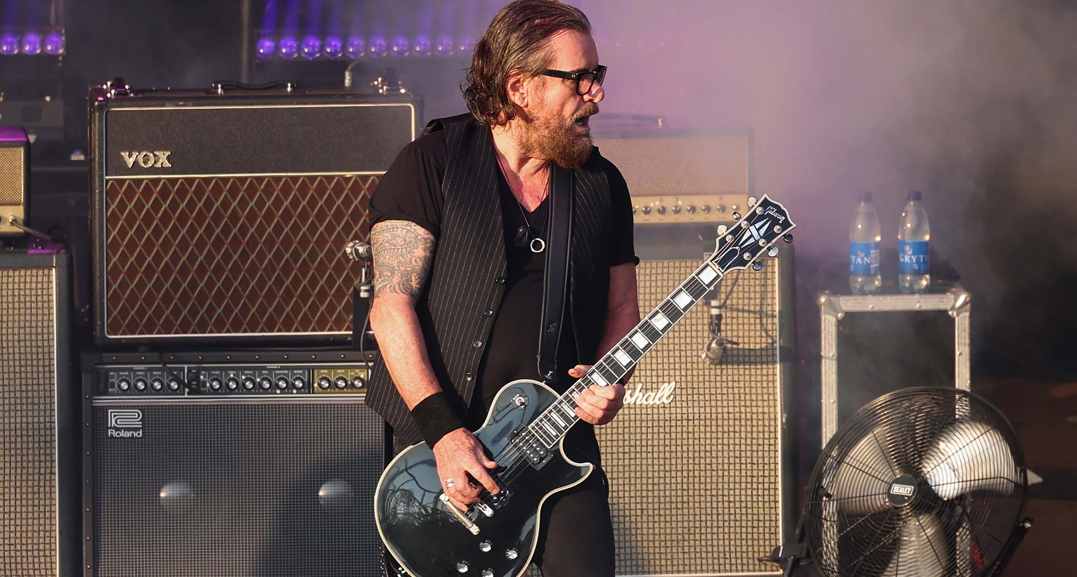 Billy Duffy performs onstage with the Cult