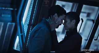 Actors Dominique Tipper (right) and Steven Strait (left) from the science fiction series "The Expanse" appear in a scene from the trailer of the show's fourth season.