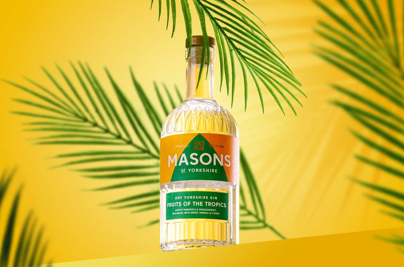 A bottle of gin against a yellow background