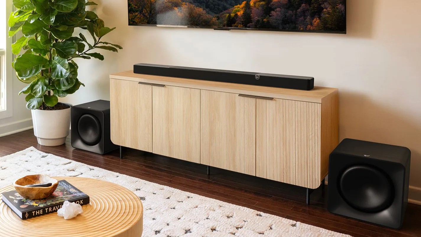 Klipsch Flexus Core 300 soundbar on stand with subwoofers