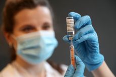 A nurse with a vaccine