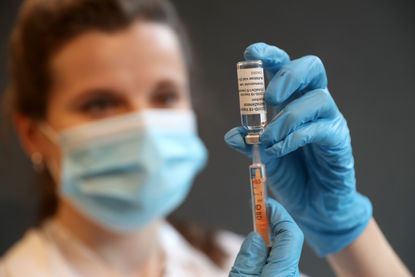 A nurse with a vaccine