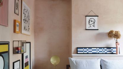 Limewashed pink bedroom with gallery wall display