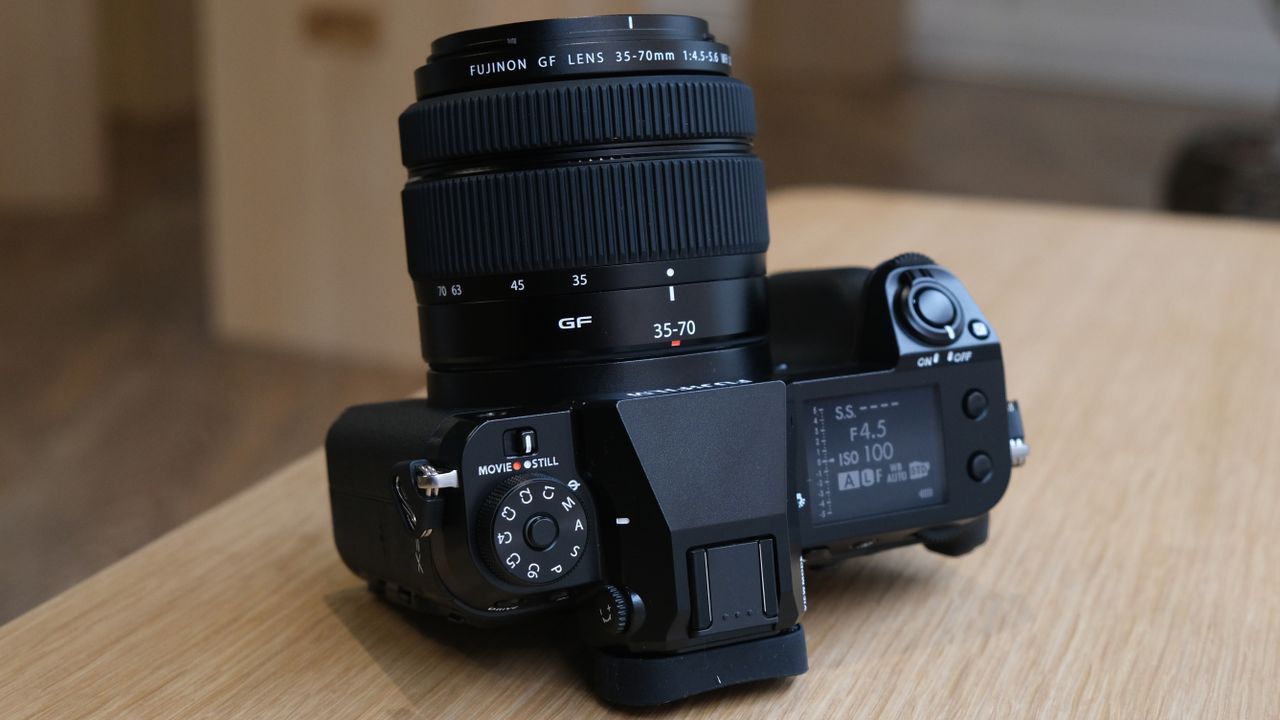 The Fujifilm GFX50S II on a wooden table