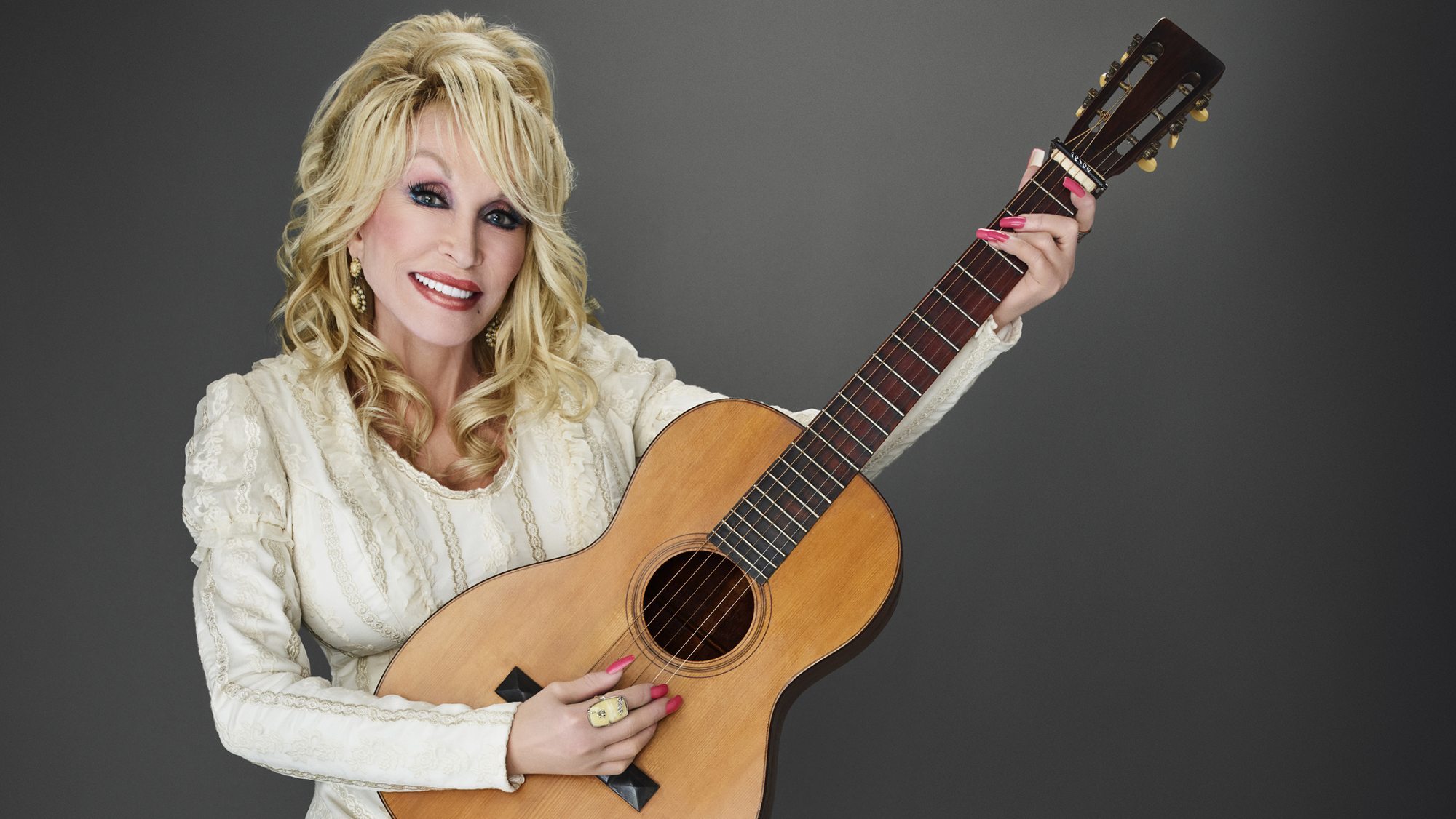 Dolly Parton in a promo photo for DOLLY PARTONS MOUNTAIN MAGIC CHRISTMAS -- Season: 2022 