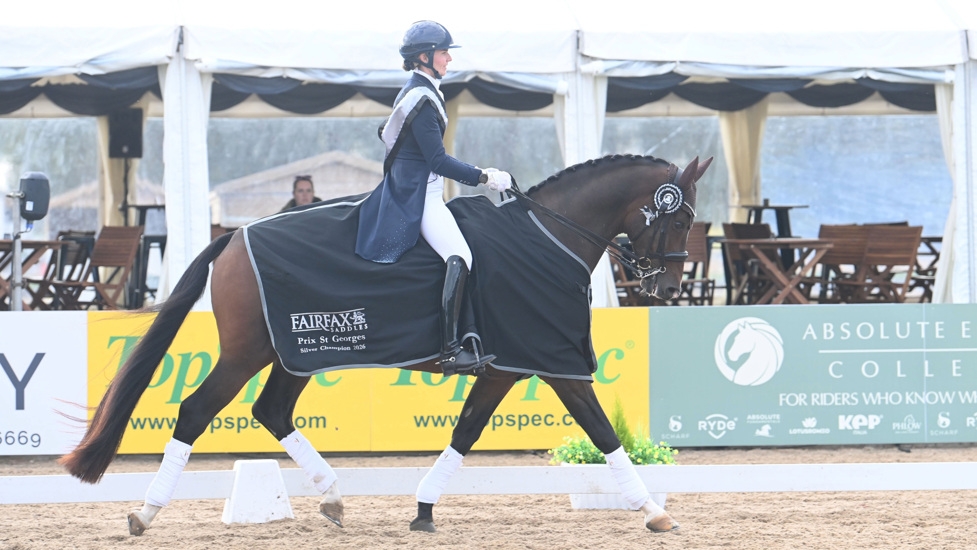Charlotte Smithwhite rides Luciano in trot, wearing the Fairfax Saddles Prix St Georges silver champion rug, at the LeMieux National Dressage Championships.