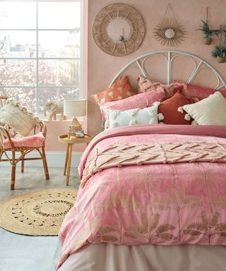 Pink boho bedroom scheme with rattan furnishings by B&M