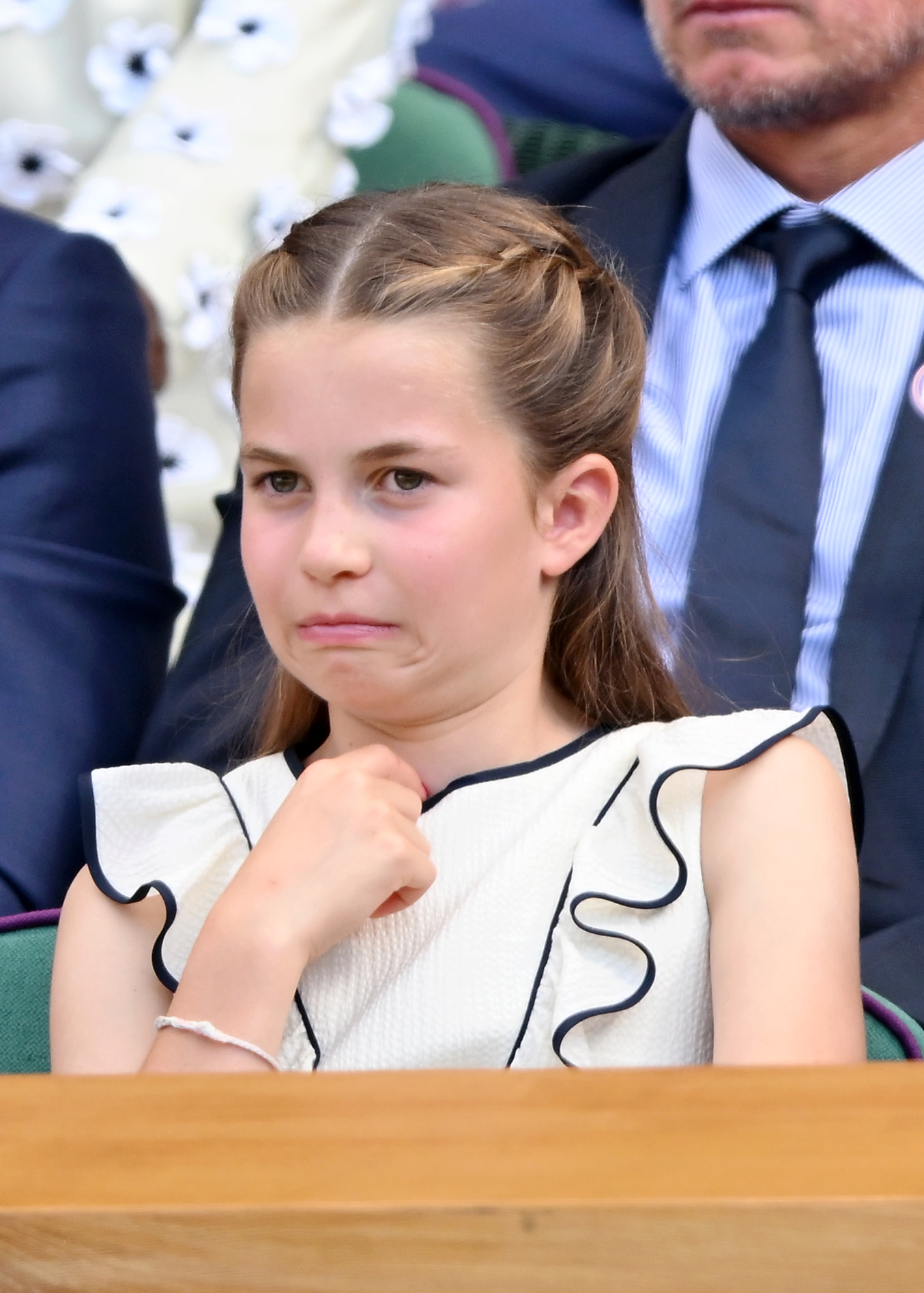 Princess Charlotte at Wimbledon making funny facial expressions