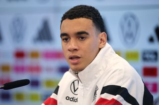 Jamal Musiala talking in a press conference for Germany as Manchester City continue their interest