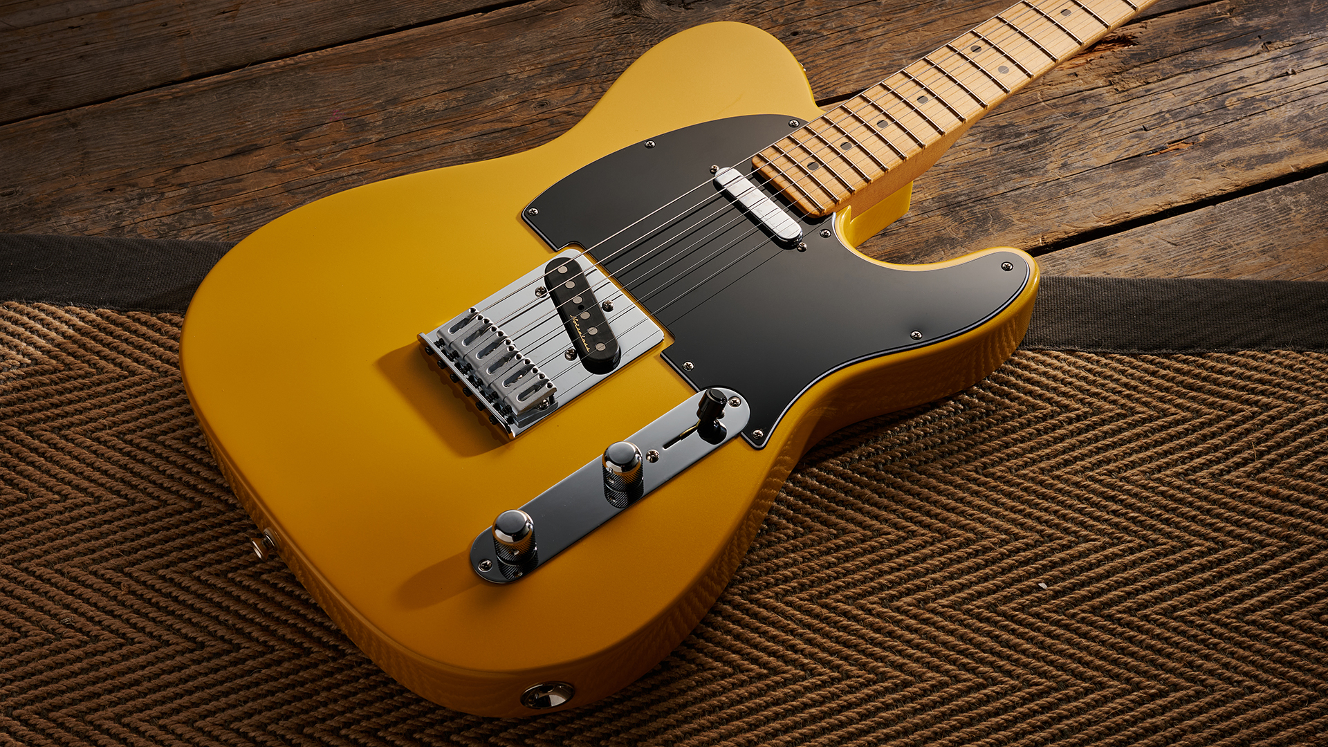 The body of a Fender Player II Modified Telecaster lying on a rug