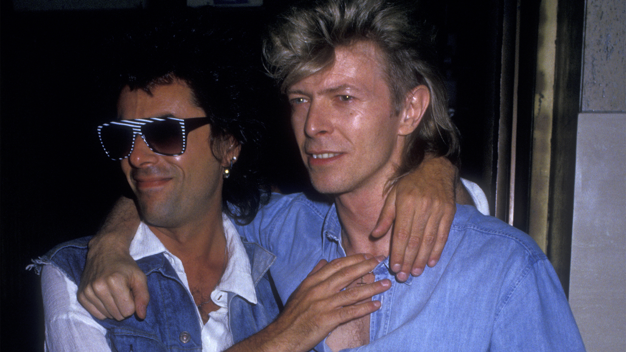 Musicians Earl Slick and David Bowie sighted on August 4, 1987 at The China Club in New York City.
