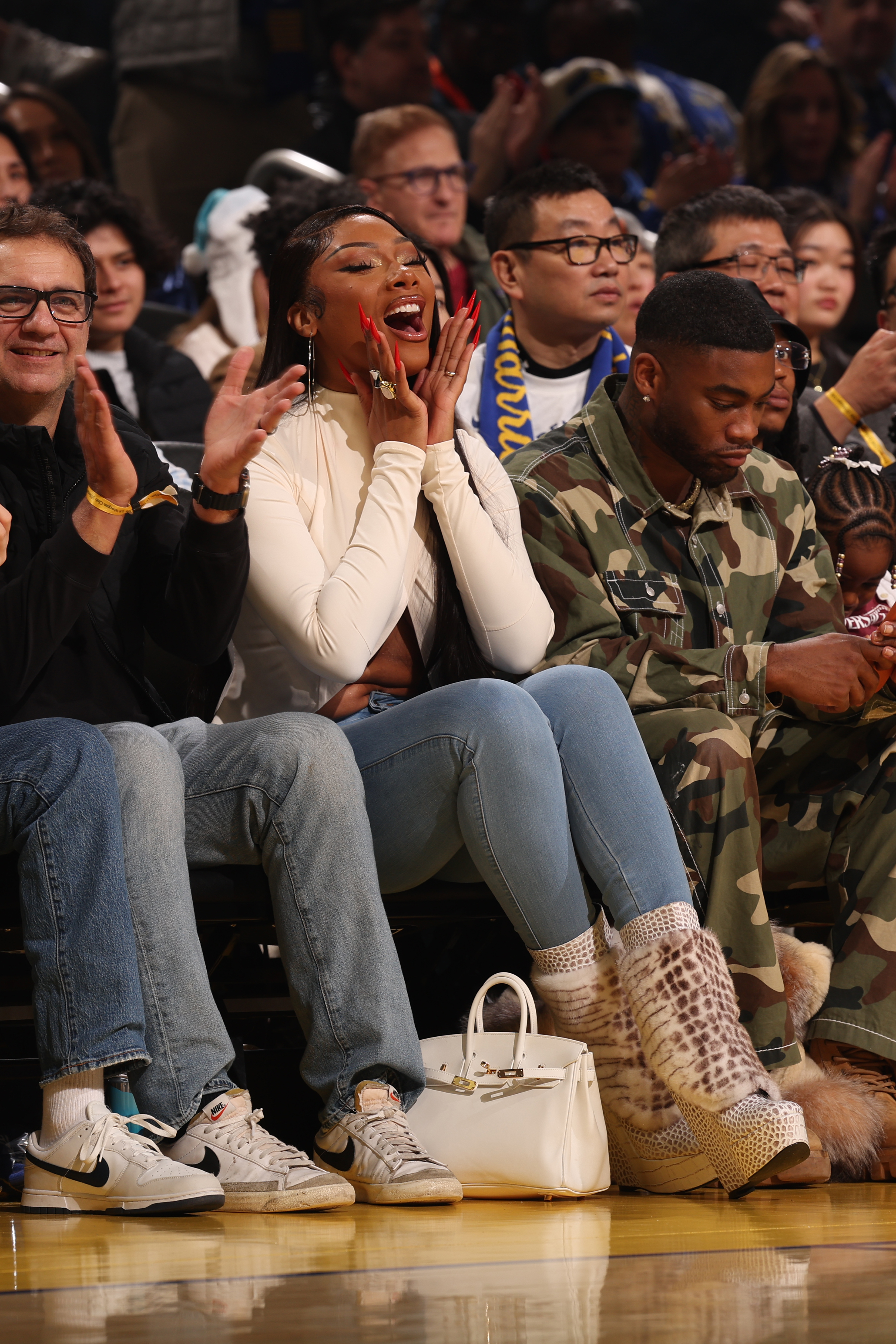 Megan Thee Stallion wearing Jennifer Le boots at a late December 2025 NBA game