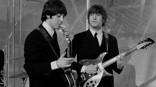 Musicians John Lennon (R) and Paul McCartney of English rock group The Beatles on the set of television special The Music of Lennon & McCartney at Granada Studios, Manchester, circa November 1965.