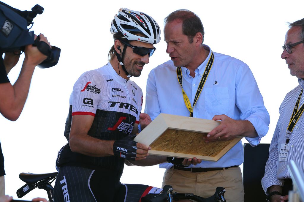 Fabian Cancellara (Trek-Segafredo) looks over this gift from ASO and the Tour de France race director Christian Prudhomme