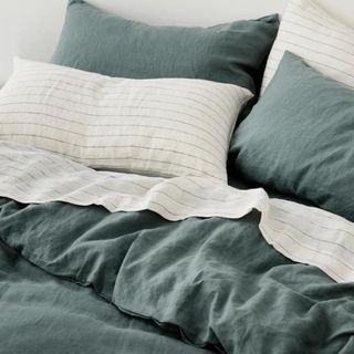 Best linen duvet covers on bed close up with duvet inset and pillows 