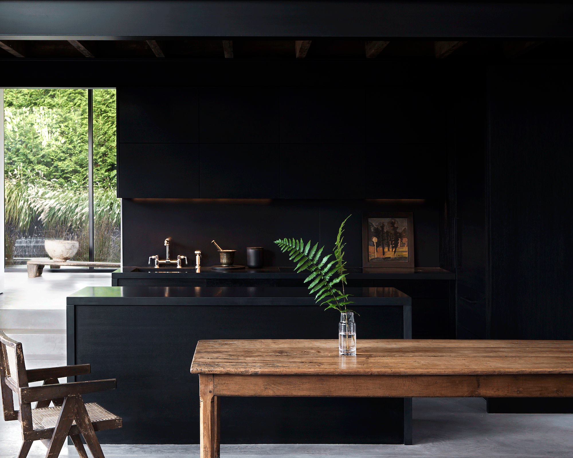 Black kitchen with wooden island