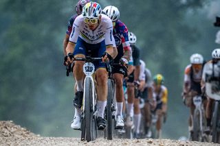 UCI Gravel World Champion Matej Mohorič at the front of the group before the rider with a flat and cracked rim pulled the pin