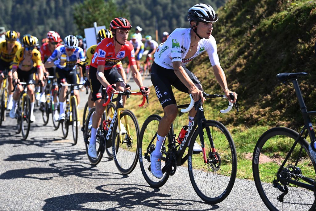 LARRABELAGUA SPAIN SEPTEMBER 09 LR Sepp Kuss of The United States and Team JumboVisma Red Leader Jersey and Juan Ayuso of Spain and UAE Team Emirates White best young jersey compete during the 78th Tour of Spain 2023 Stage 14 a 1562km stage from SauveterredeBarn to LarraBelagua 1588m UCIWT on September 09 2023 in LarraBelagua Spain Photo by Tim de WaeleGetty Images