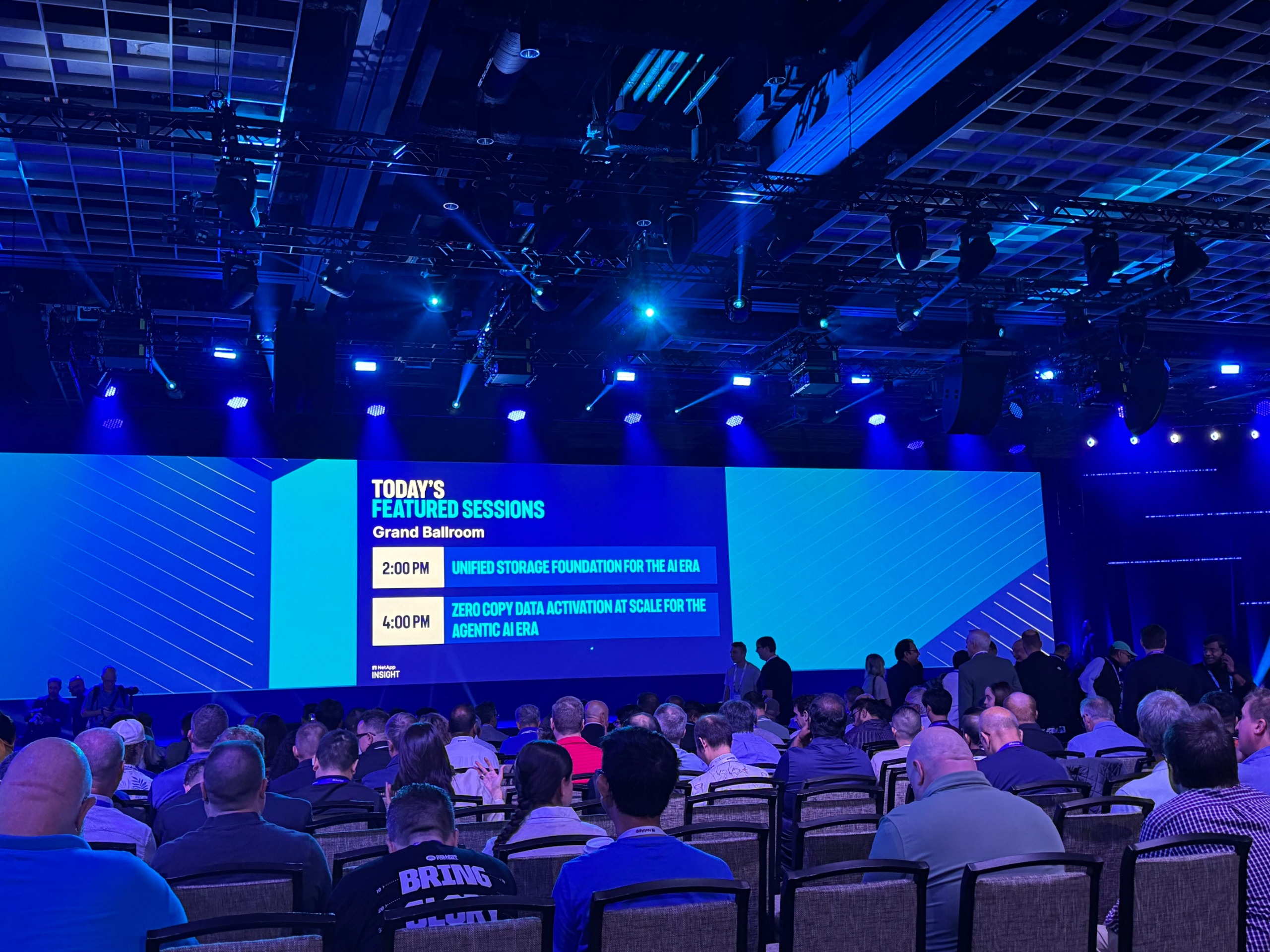 NetApp Insight 2026 keynote theatre stage with attendees sitting in seats.