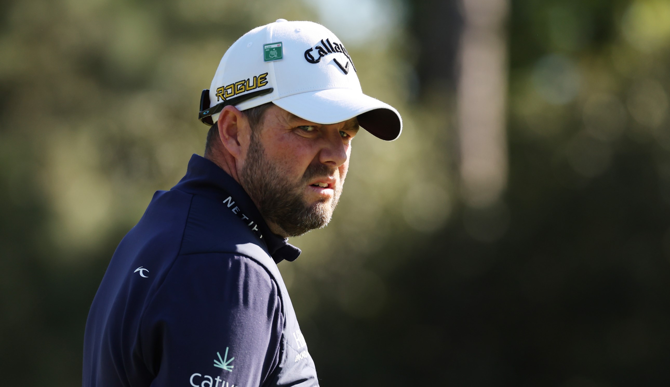 Leishman stares on with a hat on