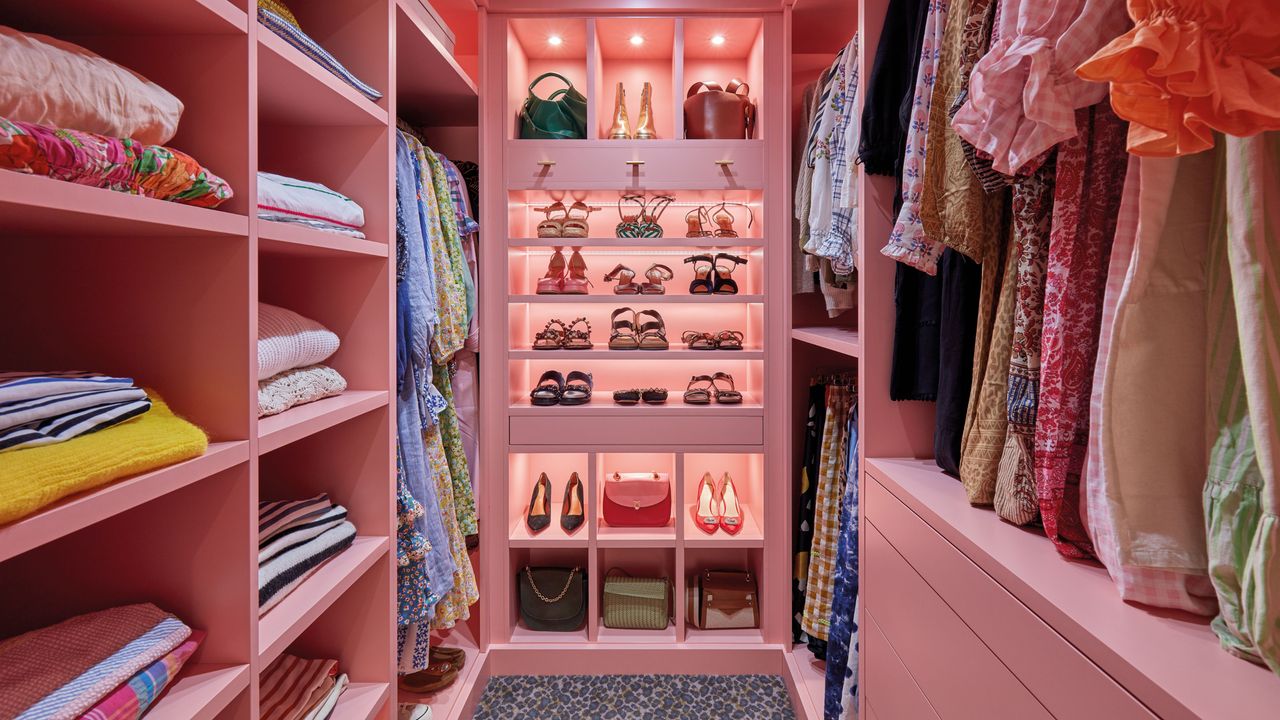 Pink walk in wardrobe with leopard print carpet