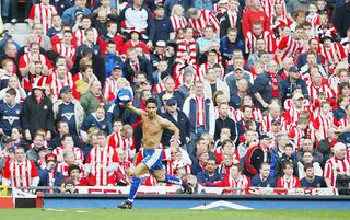 MANCHESTER, ENGLAND - APRIL 4: Tim Cahill of Millwall celebrates his goal in front of the Sunderland fans during the FA Cup Semi Final match between Sunderland and Millwall at Old Trafford on April 4, 2004 in Manchester, England. (Photo by Laurence Griffiths/Getty Images)