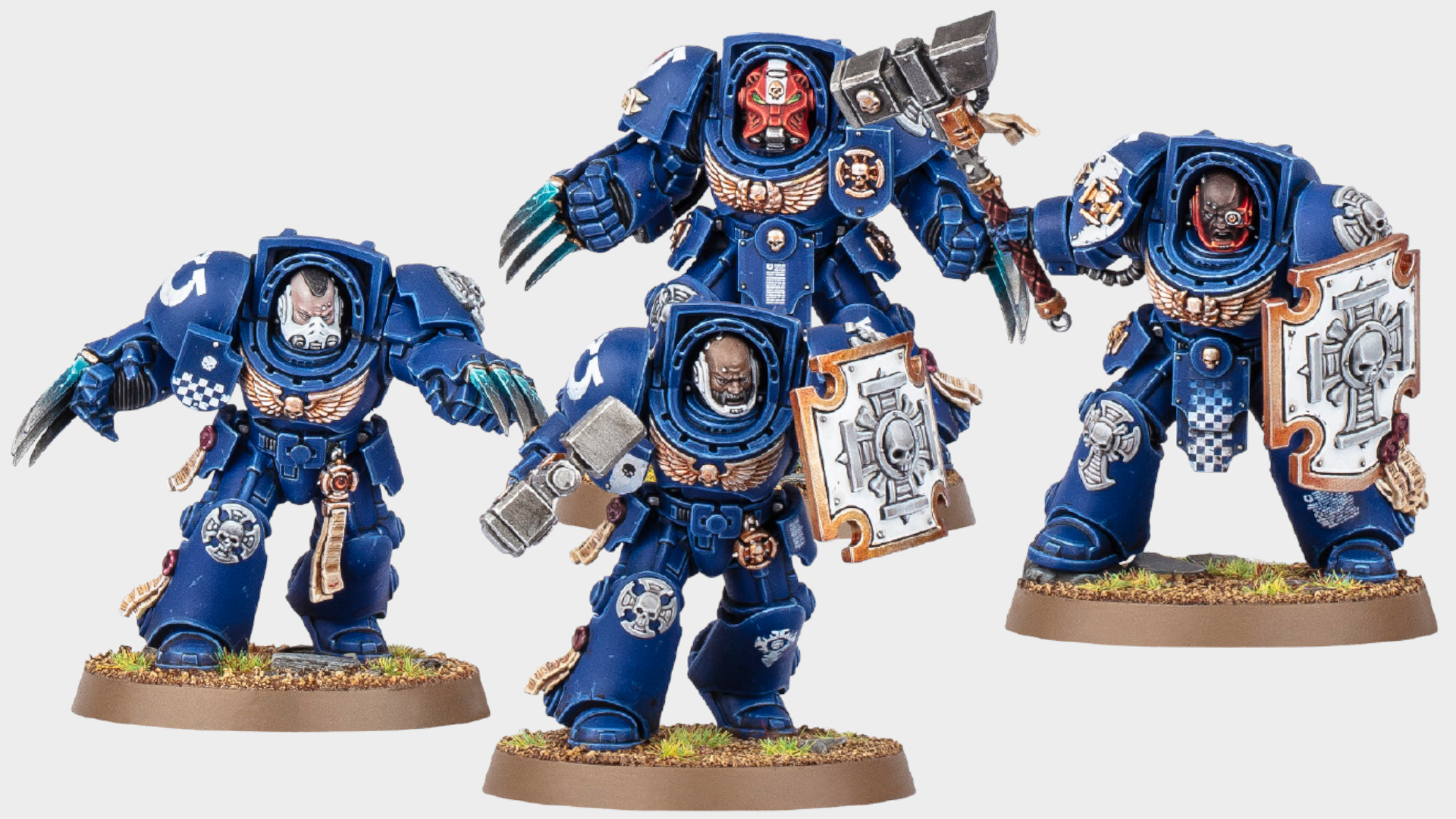 Four Assault Terminators on a plain background