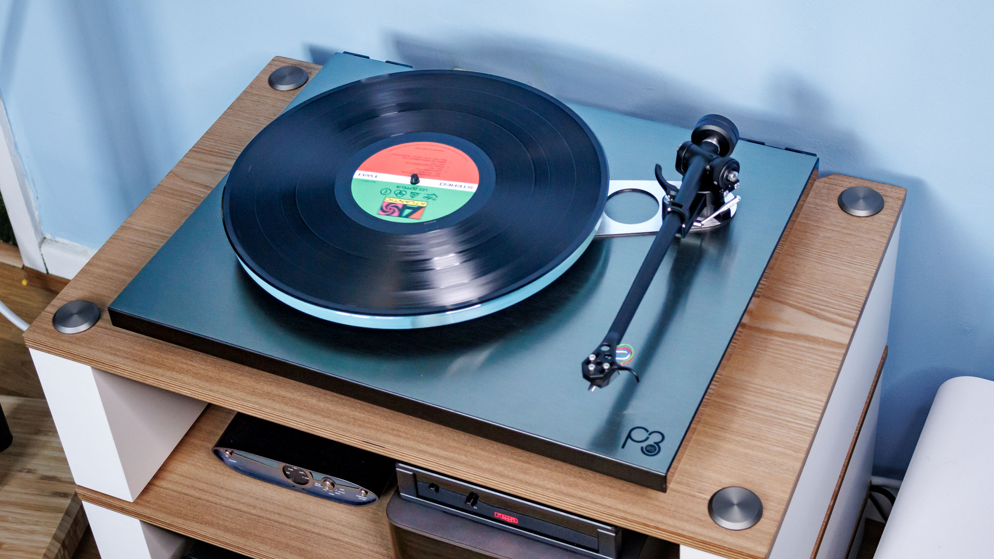 The Rega Planar 3 RS on an entertainment stand.