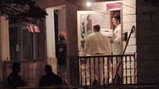 CLEVELAND, OH - MAY 7:FBI agents remove evidence from the house where three women who had disappeared as teenagers approximately ten years ago, were found alive on Monday May 7, 2013 in Cleve