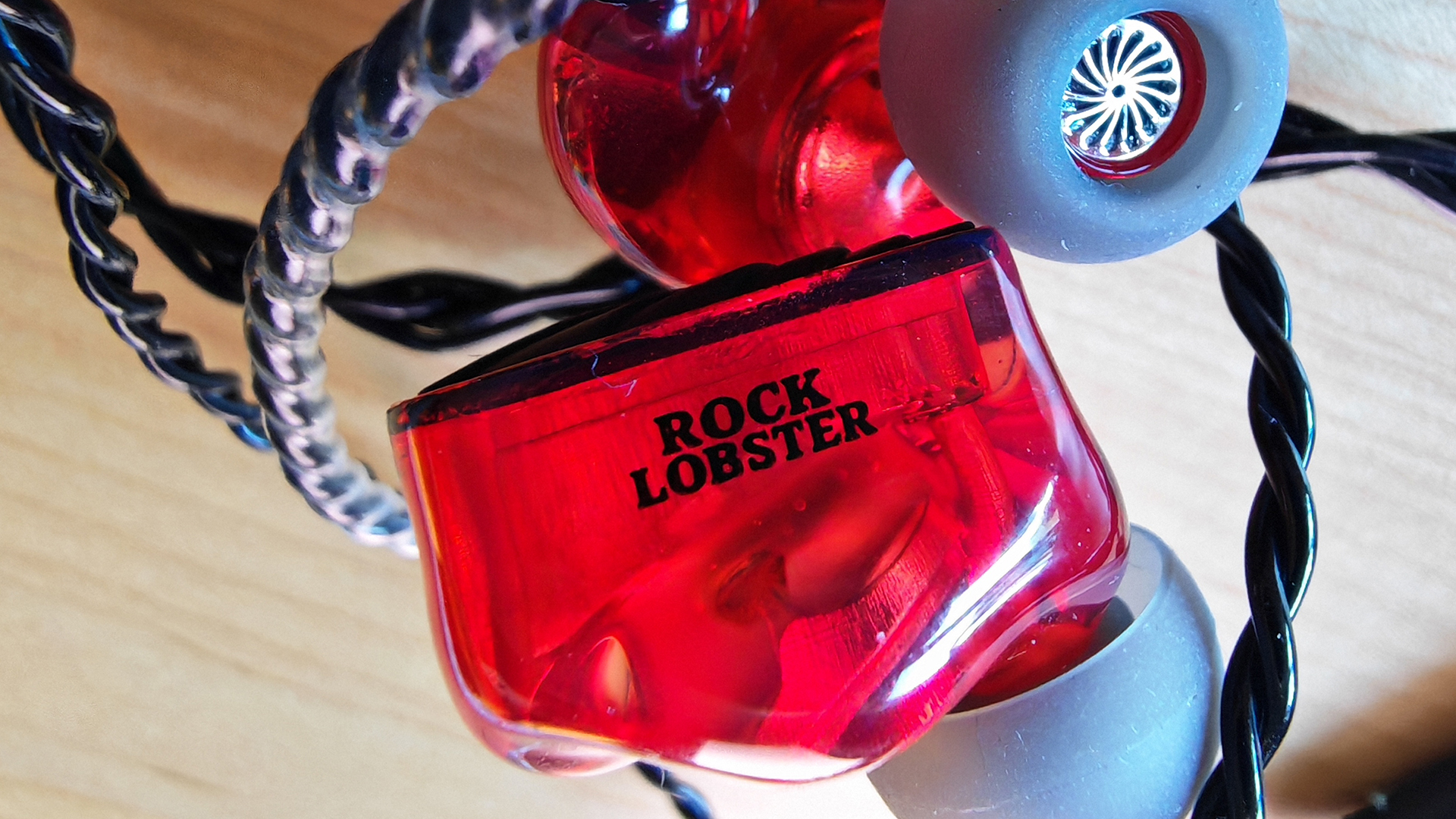 Various photos of the Rock Lobster IEM.