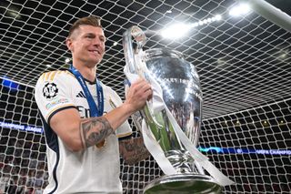 Toni Kroos celebrates with the Champions League trophy after Real Madrid's win over Borussia Dortmund at Wembley in June 2024.