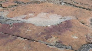 Ancient hunter-gatherers created rock art next to dinosaur footprints in what is now Brazil.