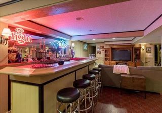 bar and lounge area with red light