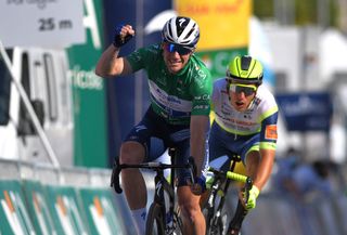 TAVIRA PORTUGAL MAY 07 Sam Bennett of Ireland and Team Deceuninck QuickStep Green Points Jersey celebrates at arrival ahead of Danny Van Poppel of Netherlands and Team Intermarch Wanty Gobert Matriaux during the 47th Volta Ao Algarve 2021 Stage 3 a 2031km stage from Faro to Tavira VoltAlgarve VAlgarve2021 on May 07 2021 in Tavira Portugal Photo by Luc ClaessenGetty Images