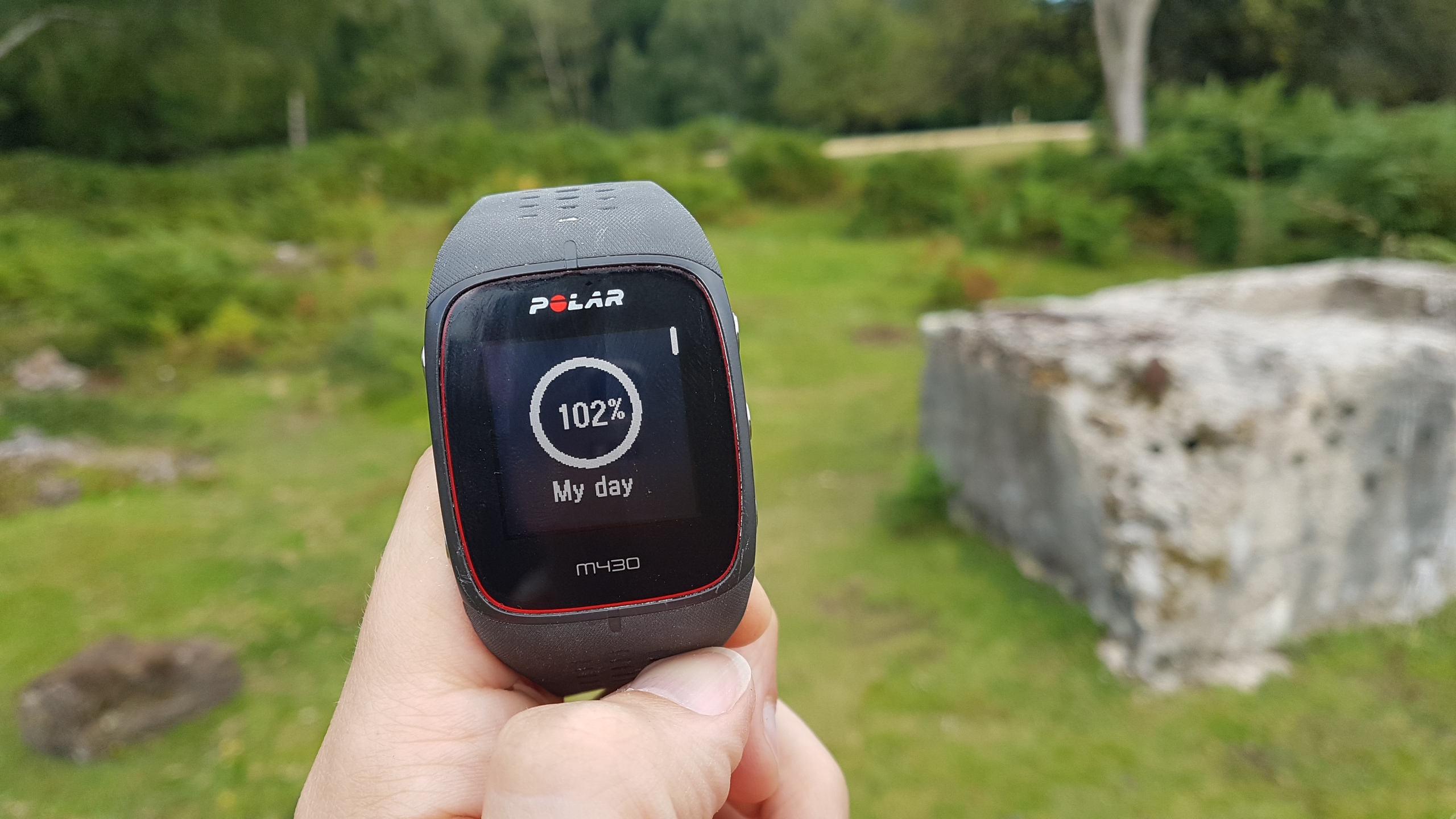 Polar M430 held in hand outdoors