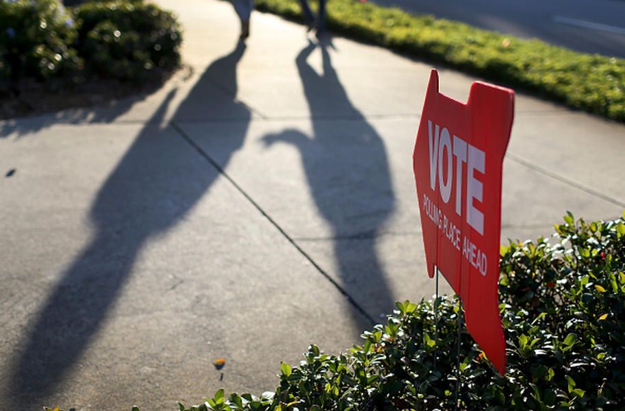 Town council candidate arrested at polling place for stealing signs