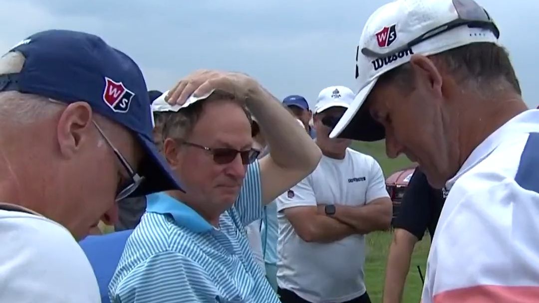 Padraig Harrington with a fan after his tee shot in the PGA Seniors Championship hit his head