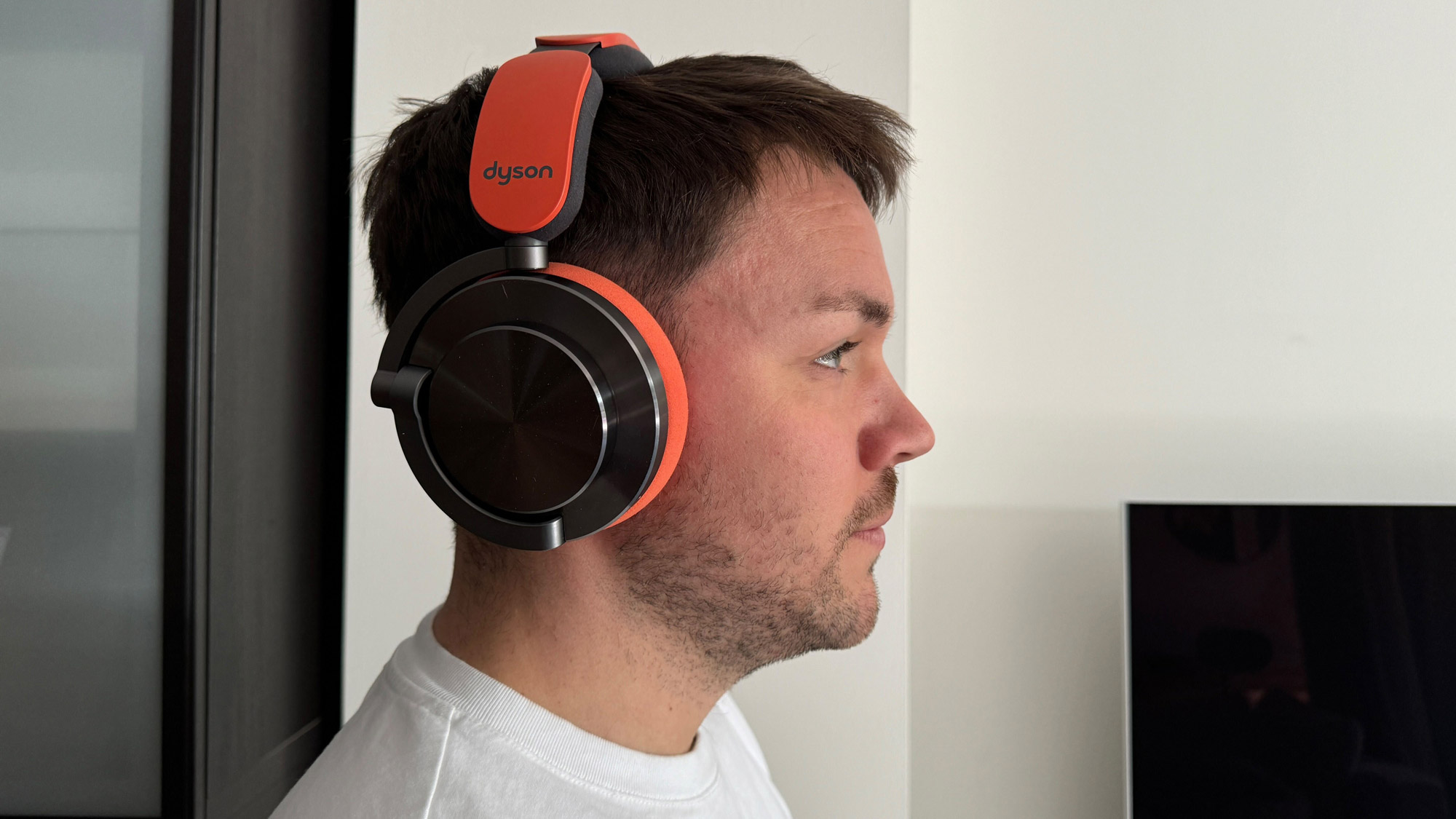 The Dyson OnTrac headphones viewed when worn on the head, from the front and side