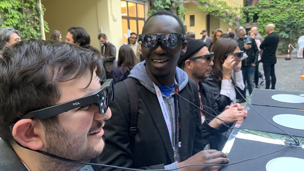 TCL NXTWEAR G glasses worn by two men, outside at Milan Design Week