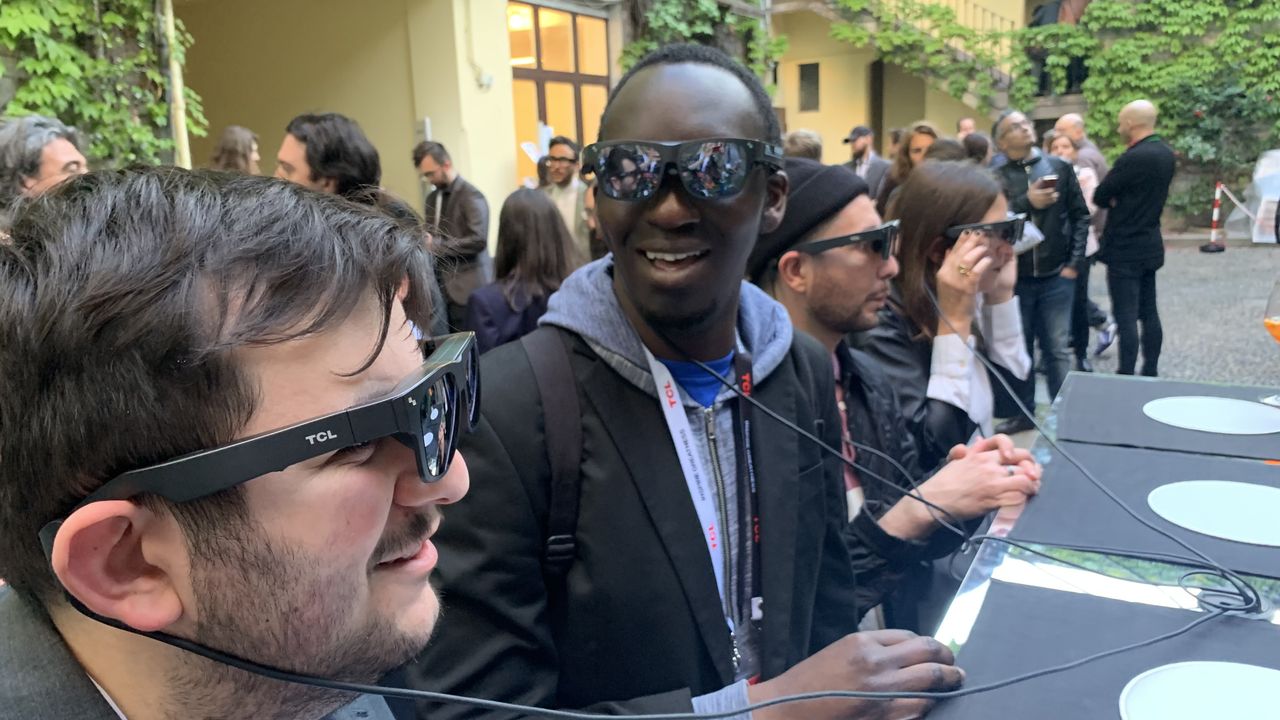 TCL NXTWEAR G glasses worn by two men, outside at Milan Design Week