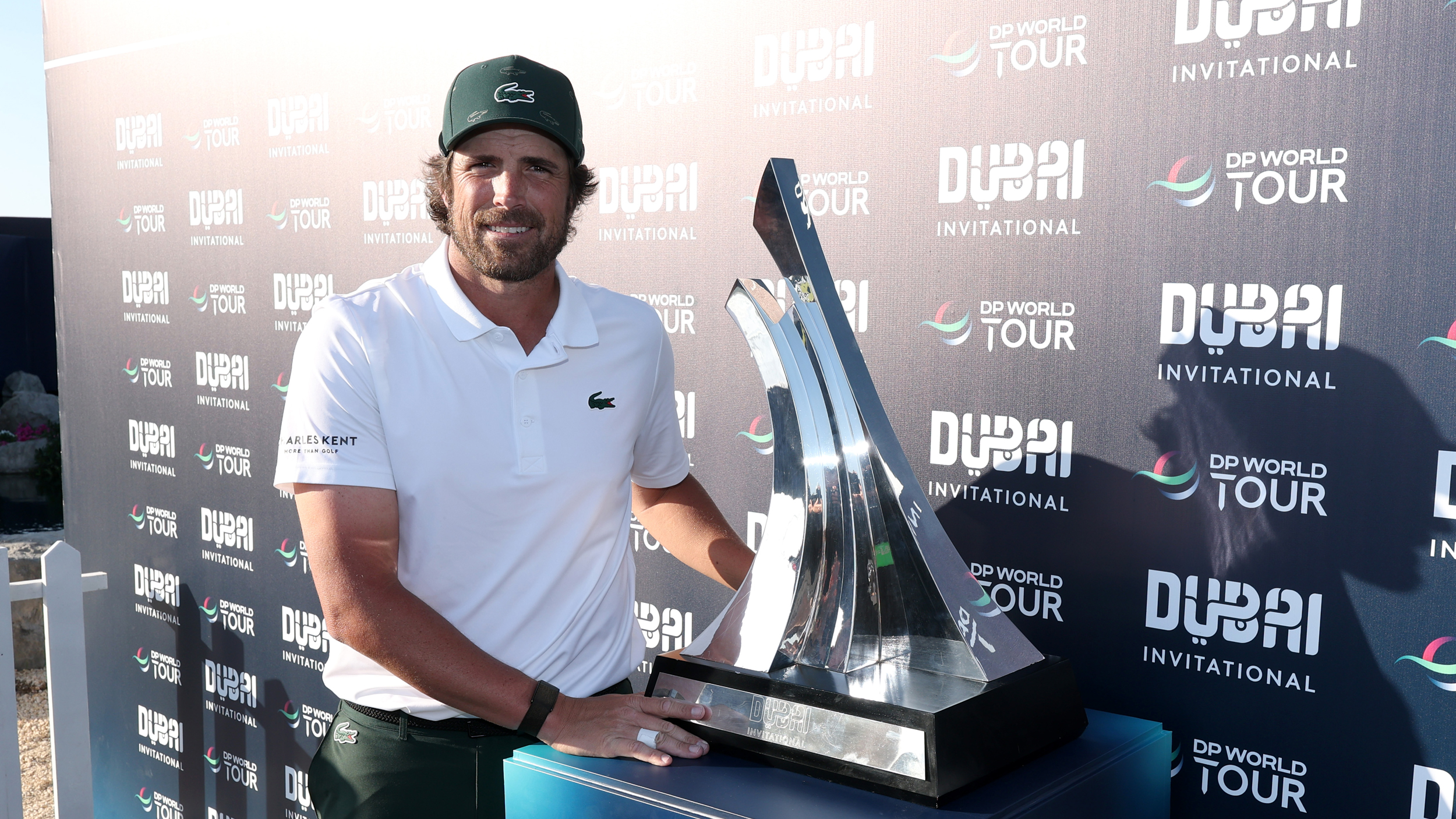 Nacho Elvira poses with the Dubai Invitational trophy following his victory in 2026