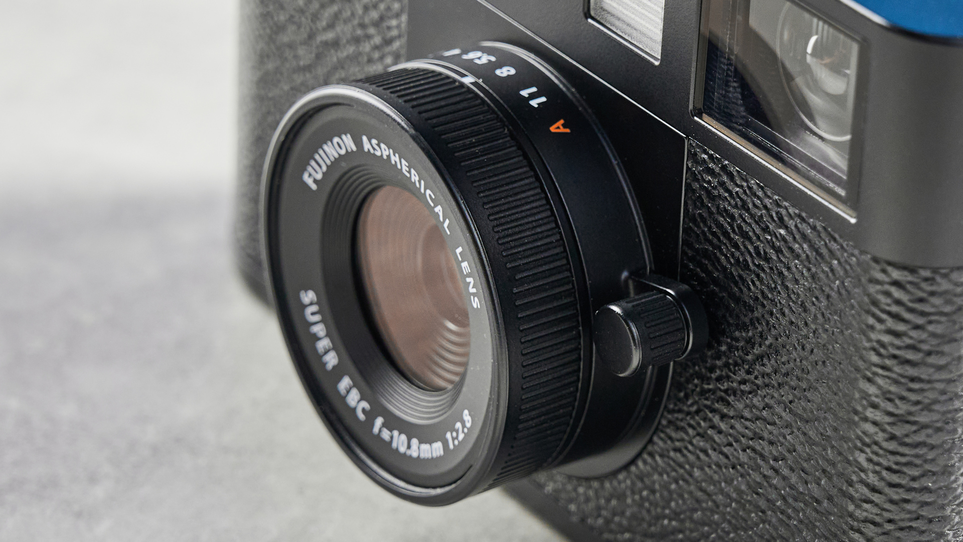 A black Fujifilm X half camera