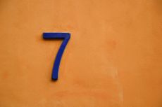 image of a purple number 7 on an orange background