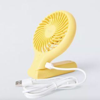 Folded yellow handheld fan