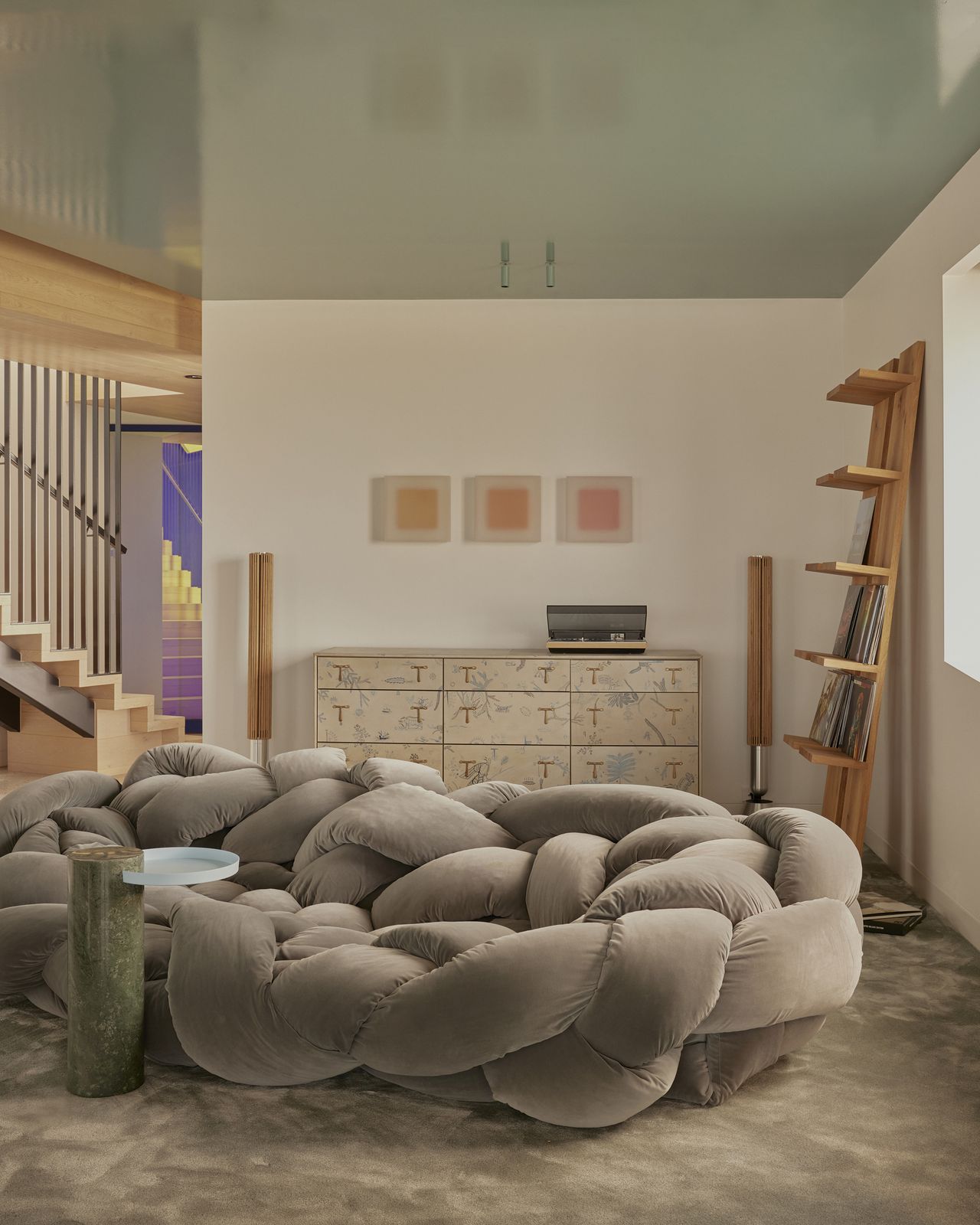 modern rumpus room with glossy colored ceiling with edra rope sofa