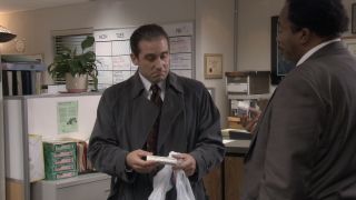 Michael looking at an ice cream sandwich in The Office